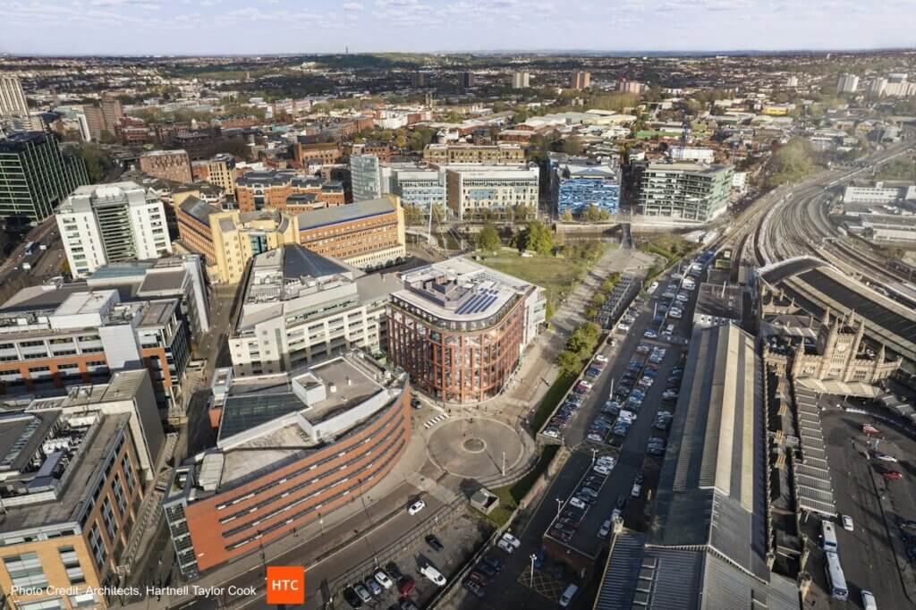 Aerial CGI view of the One Friary redevelopment project in Temple Quay, Bristol, showing modern office buildings, landscaped areas, and surrounding cityscape from a high vantage point.